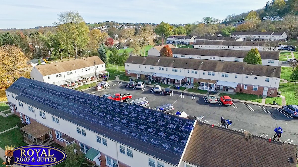 Aerial drone photo of a multi-unit roof replacement in progress